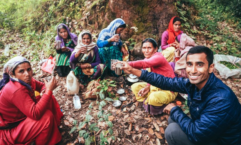 Young Mountain Tea founder Raj cheers tea farmers.